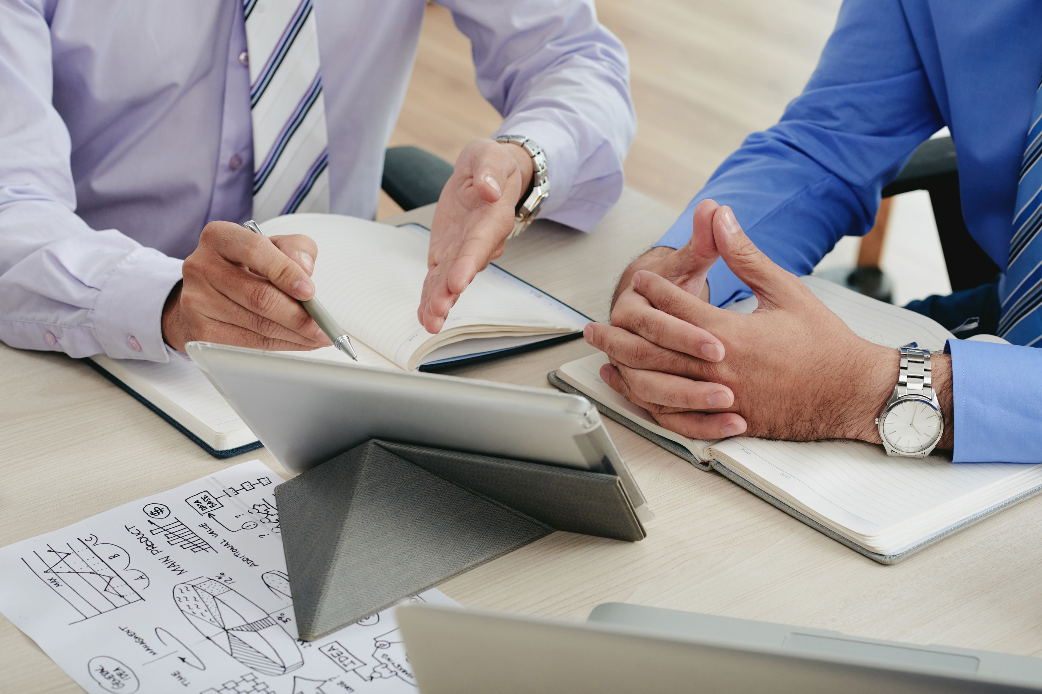 A closeup shot of dirty metal gears on a grid under light